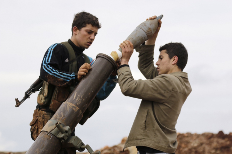Nusra fighters prepare to fire a mortar toward Assad forces in al-Mallah farms, north of Aleppo, on Feb. 18, 2015. Nusra fighters prepare to fire a mortar toward Assad forces in al-Mallah farms, north of Aleppo, on Feb. 18, 2015.